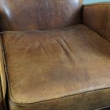 Paire de fauteuils en cuir de mouton