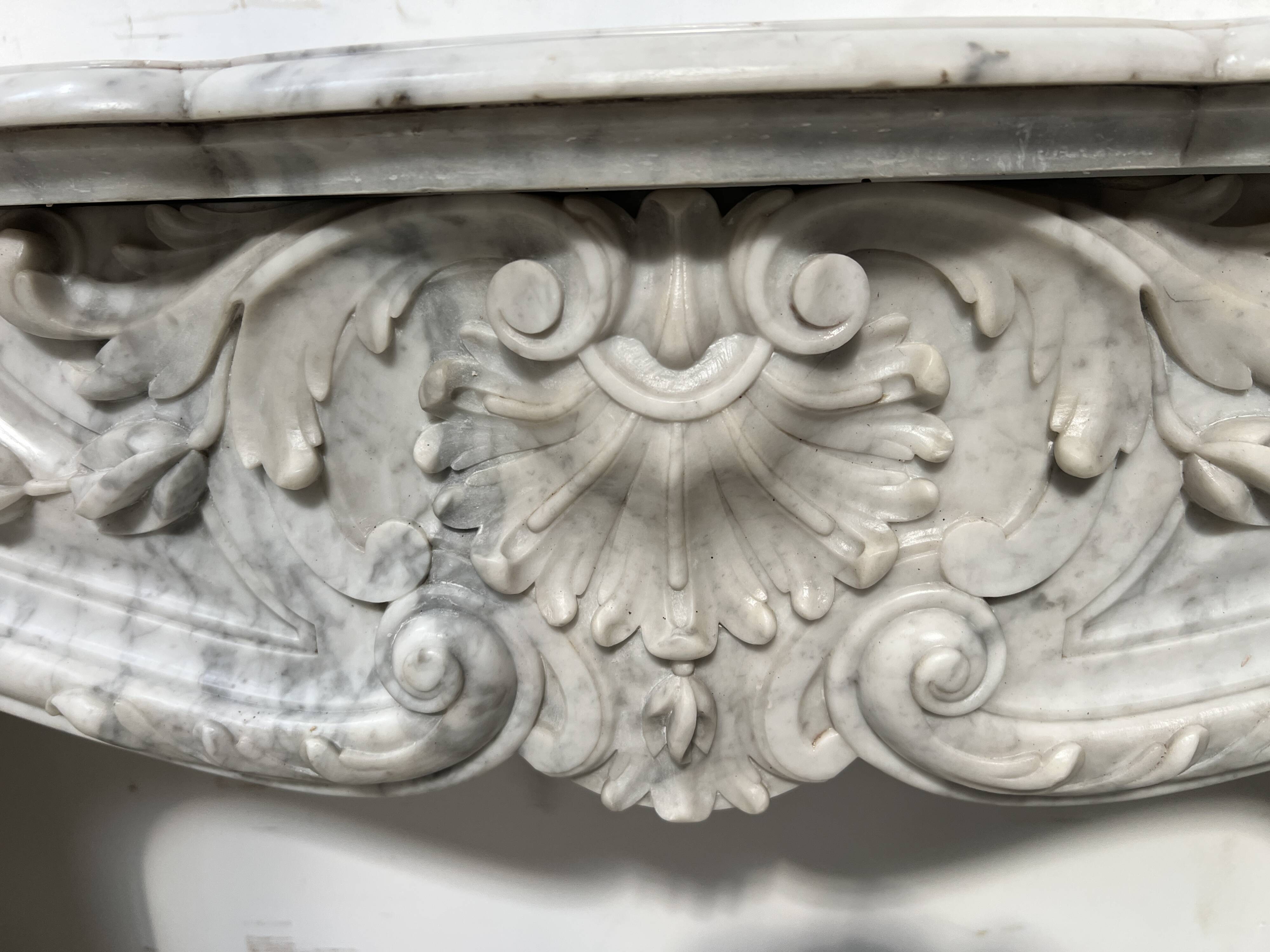 Louis XV style white Carrara marble fireplace, 19th century.