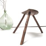 Brutalist tripod stool in solid wood half round