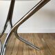 Set consisting of a table in chrome and smoked glass and its 4 tubular chairs in chrome and skaï a
