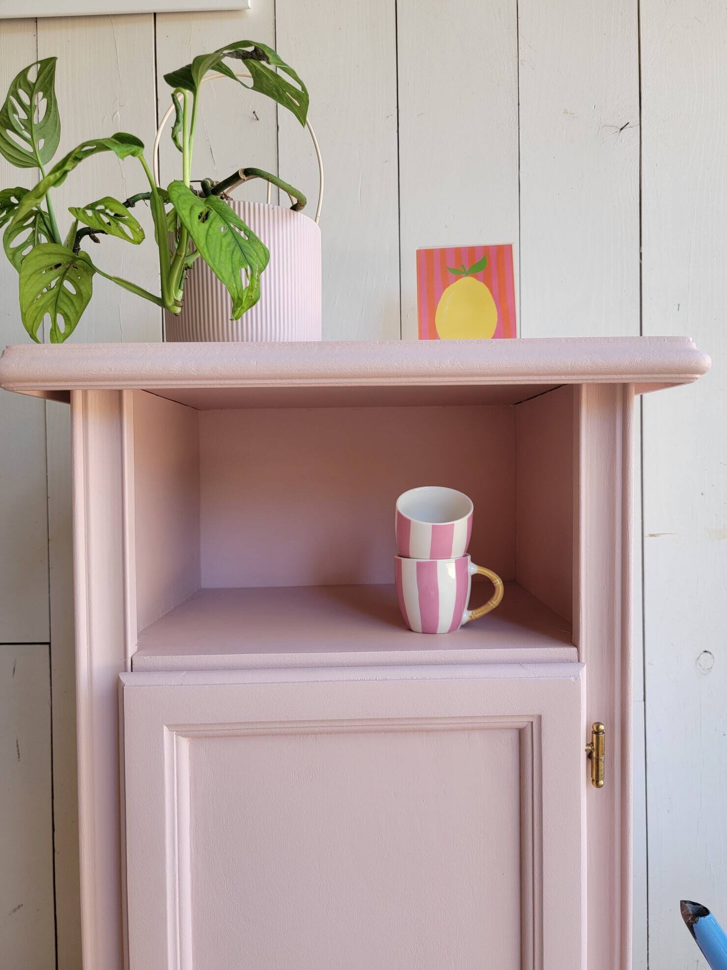 Antique bedside table revamped in pink.