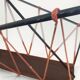 Vintage perforated metal magazine rack with cord handles by Matégot from the 1950s-60s.