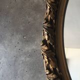 Oval golden mirror
