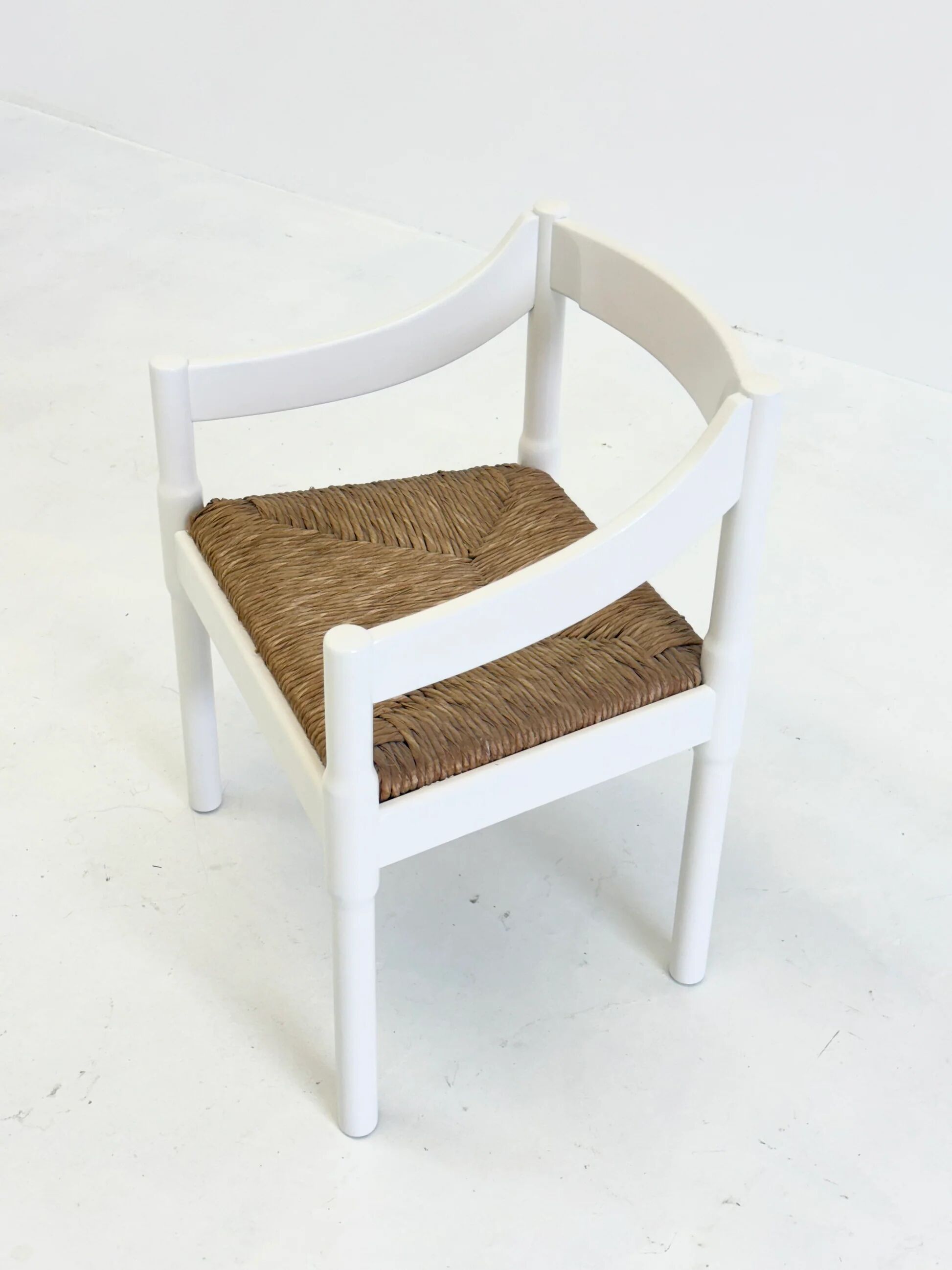 Set of two Carimate chairs by Vico Magistretti in white