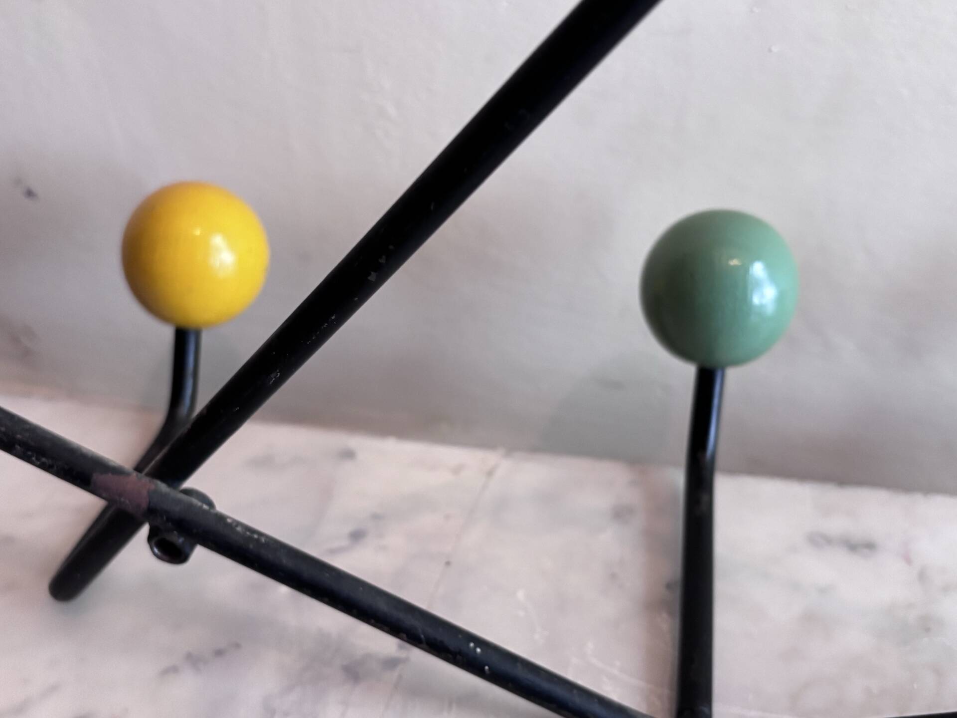 Wall coat rack Roger Feraud, metal and wooden balls.