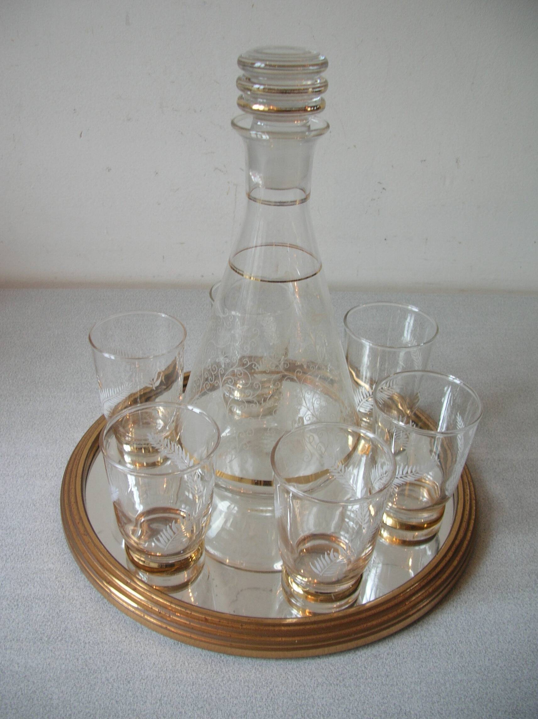 Old glass carafe liquor service with gilding vintage ice mirror tray