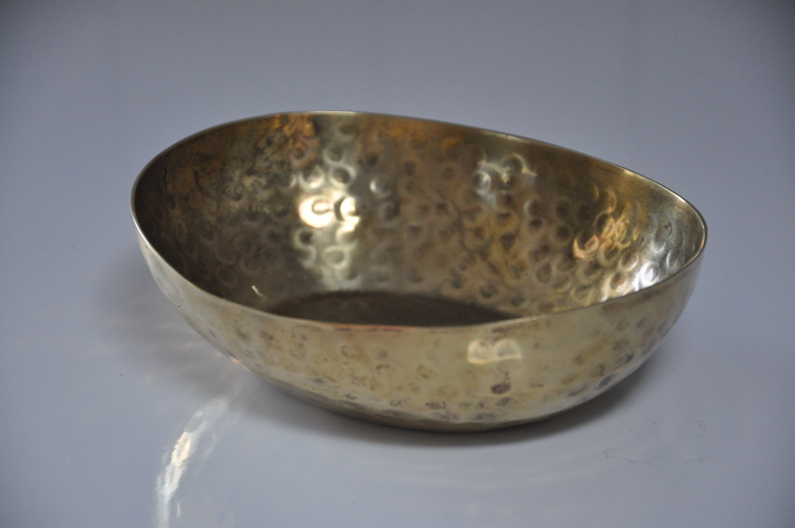 Empty hammered brass pocket
