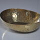 Empty hammered brass pocket