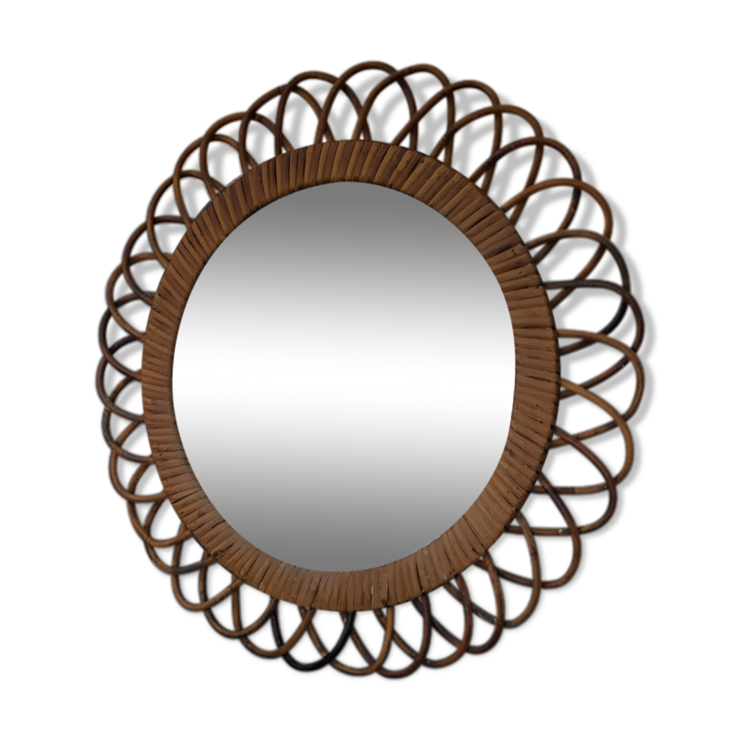 Vintage mirror in rattan flowers, sun