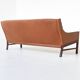 Canapé scandinave trois places en palissandre et cuir marron Danemark 1960