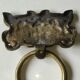 Ancient door knocker, taotié mask, shang dynasty. in bronze golden patina