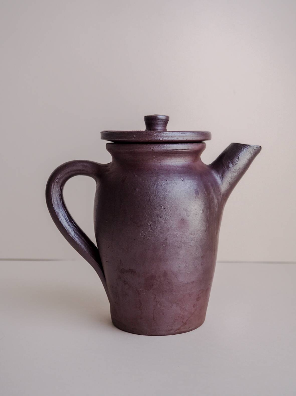 Brown ceramic artisan coffee maker