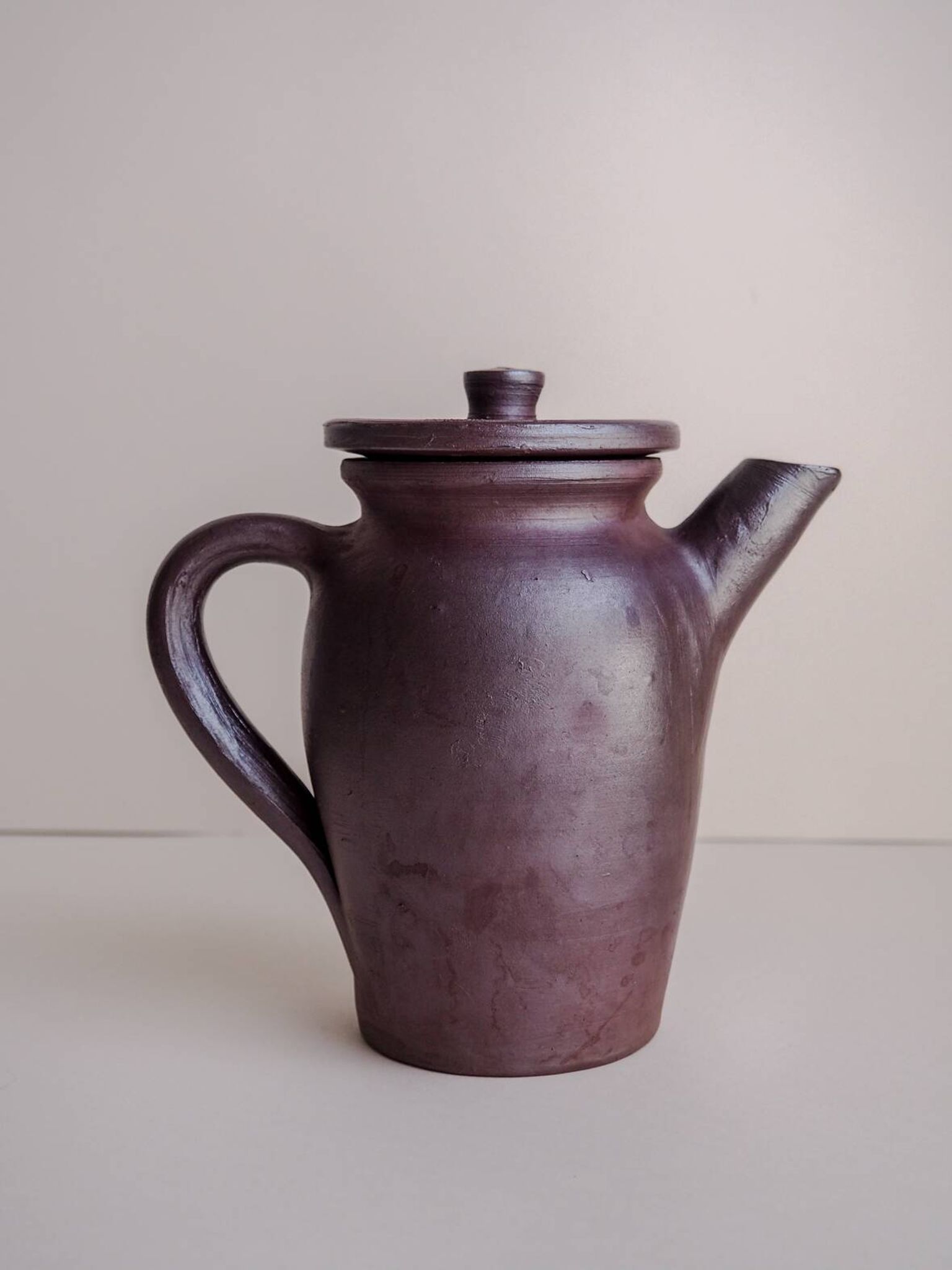 Brown ceramic artisan coffee maker