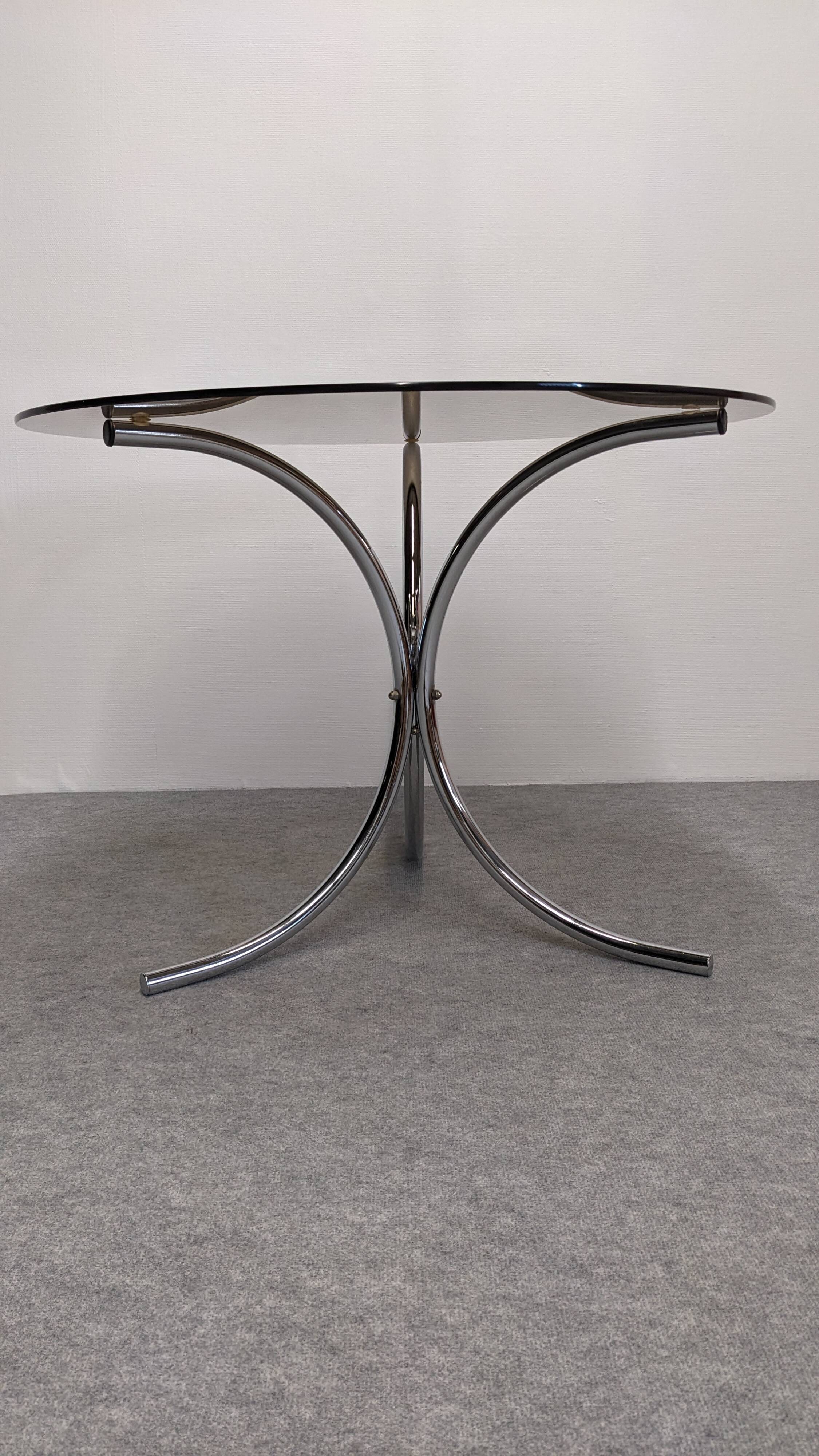 Chrome metal and smoked glass round table, Italy circa 1970.