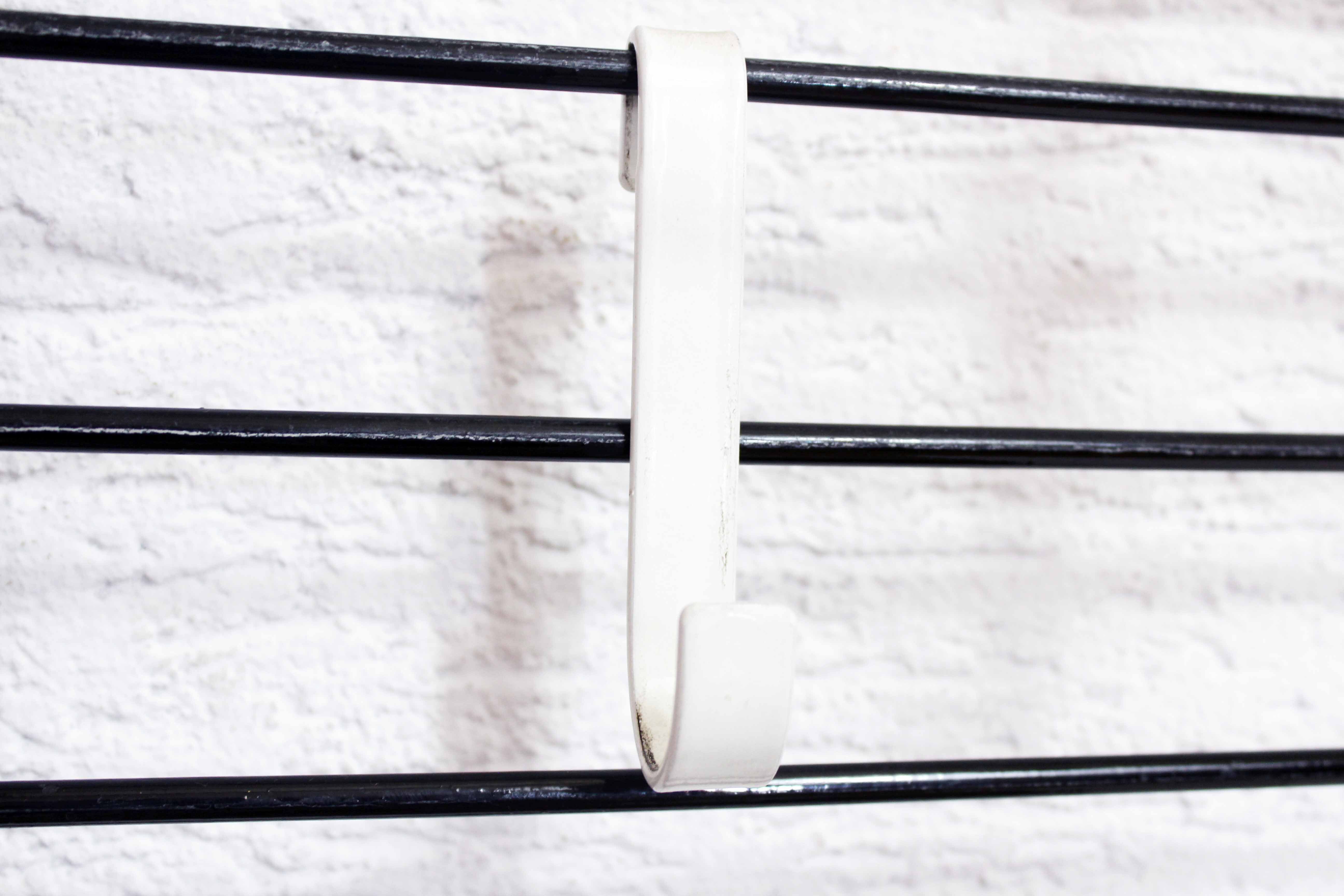 Wall coat rack with removable hooks