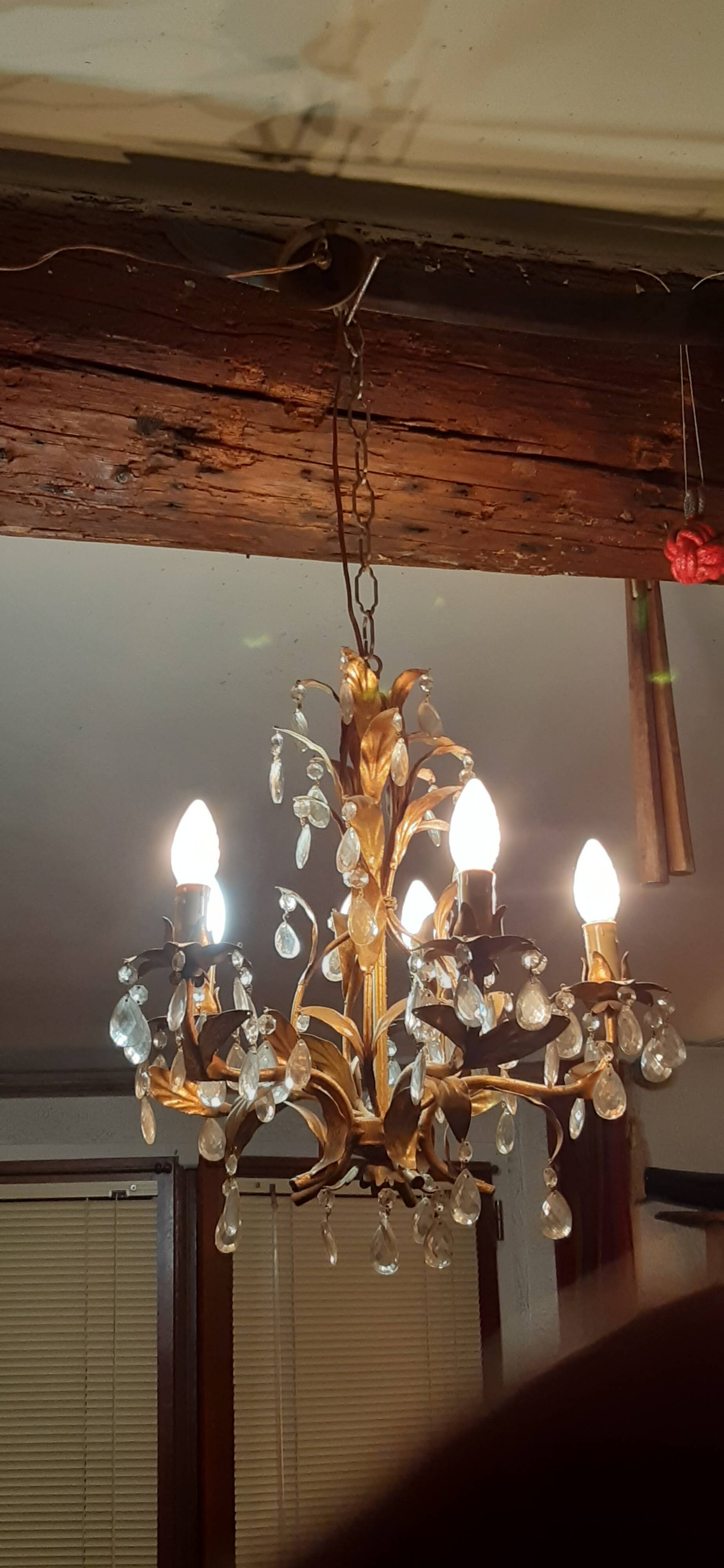 Very pretty chandelier with tassels and leaves in gold sheet metal.