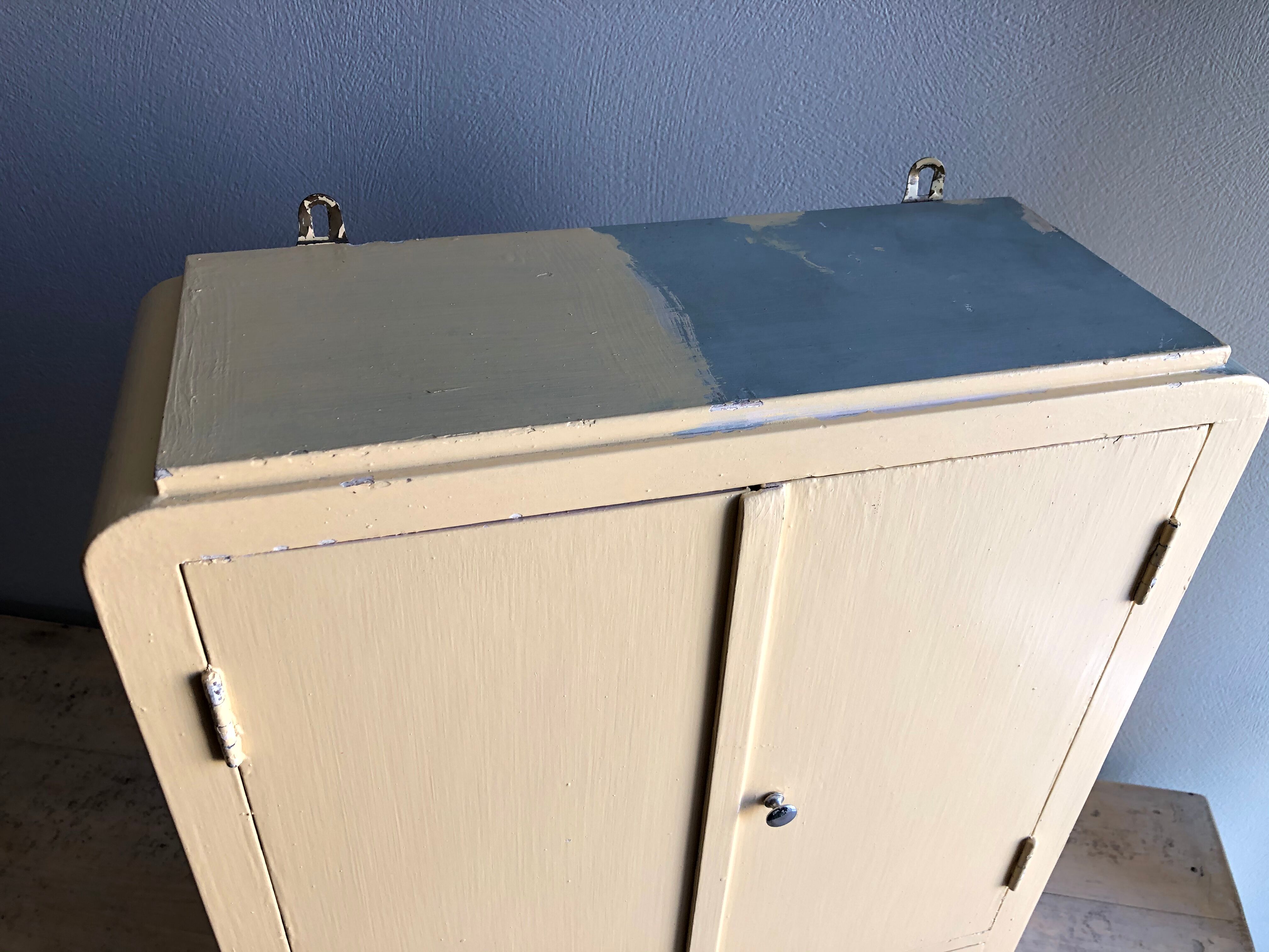 Weathered toilet cabinet