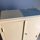 Weathered toilet cabinet