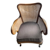 Chair with cane back and recently reupholstered fabric seat.