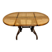 Vintage dining table with a cane top by Mundus from the 1970s.