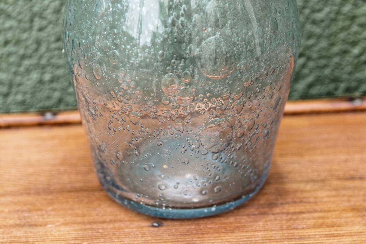 Biot blown glass bottle
