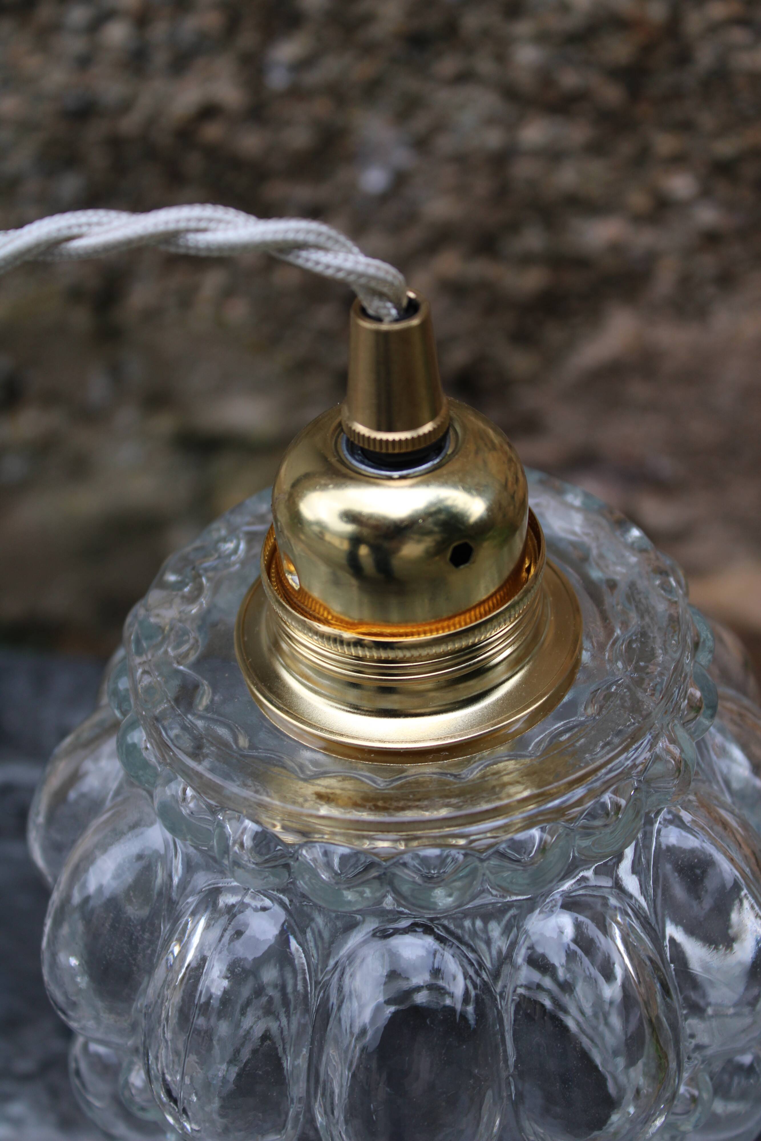 Moulded glass globe hand lamp