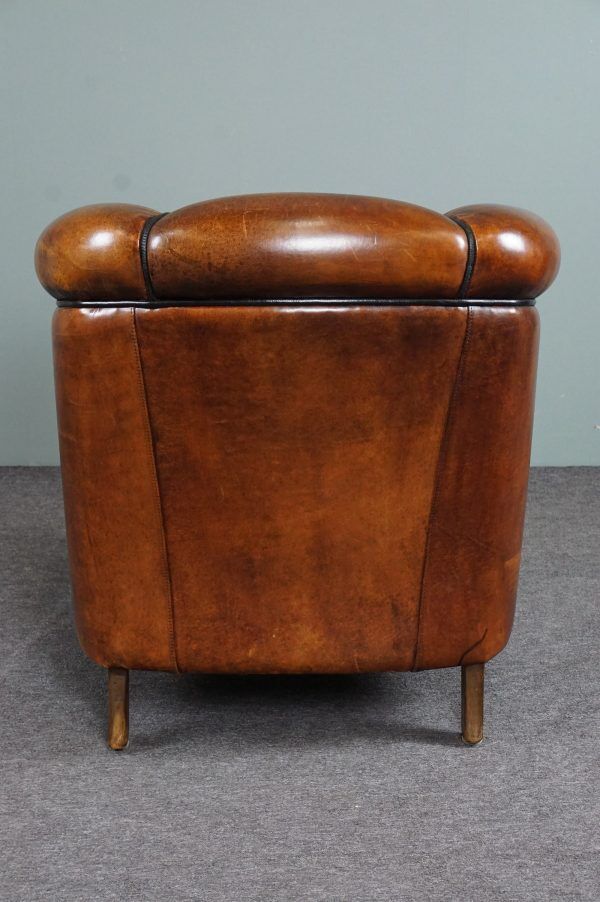 Club armchair in warm coloured sheepskin