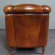 Club armchair in warm coloured sheepskin