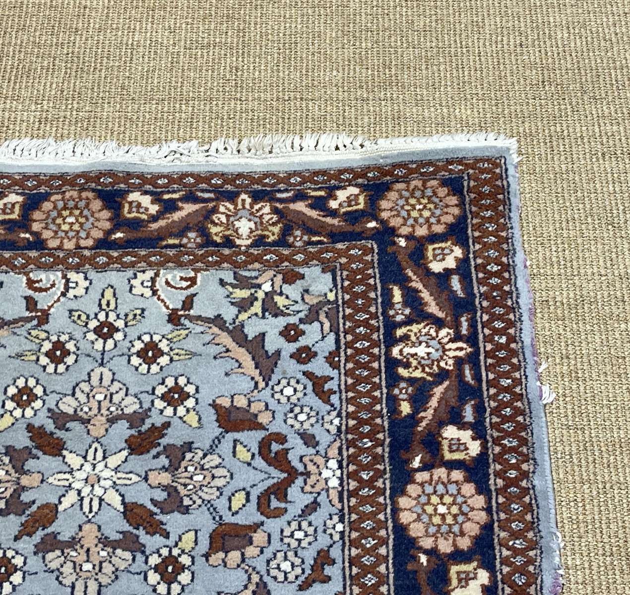 Handmade wool oriental carpet (wear defects)