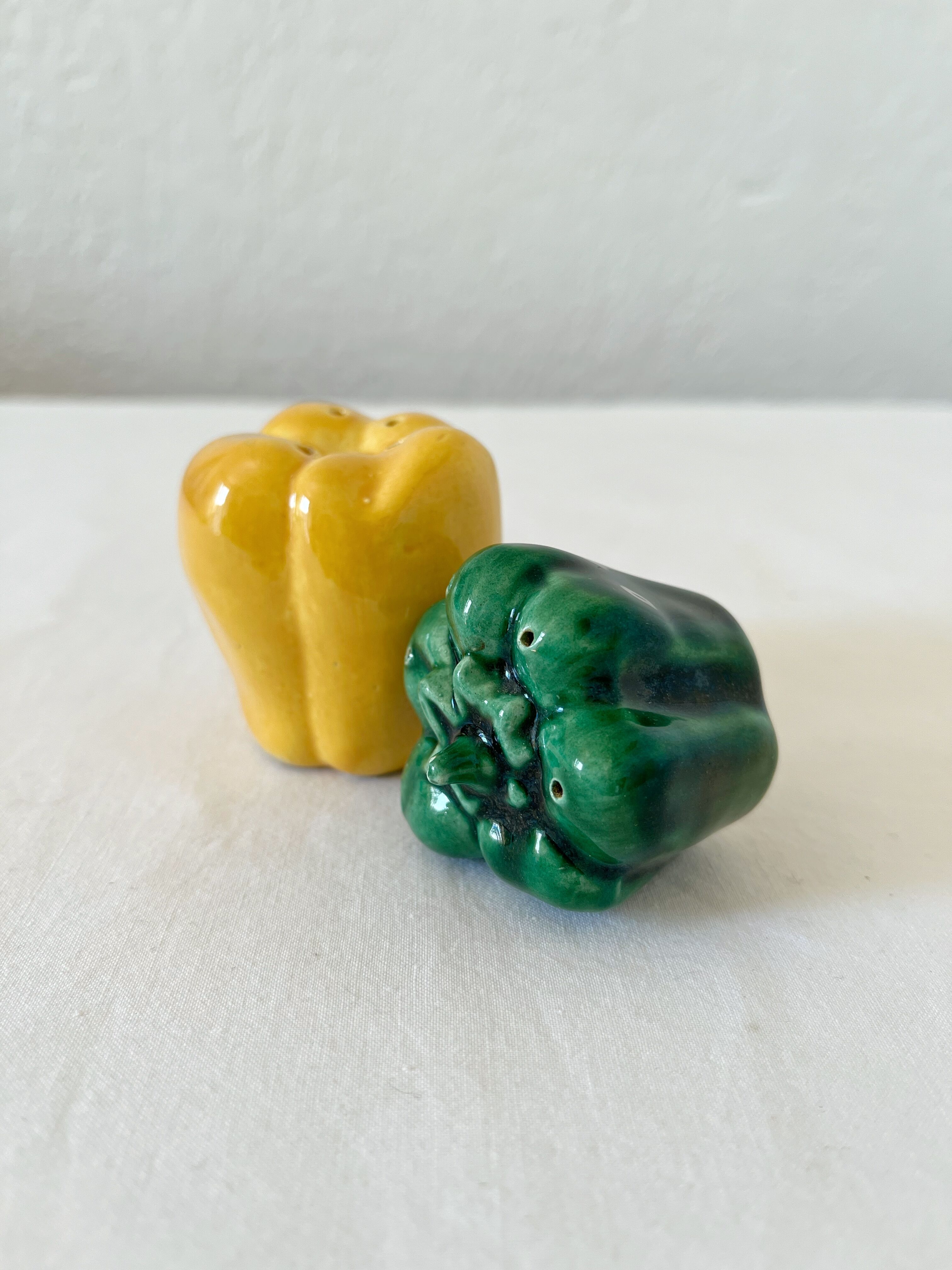 Salt shaker and pepper shaker in vintage slip