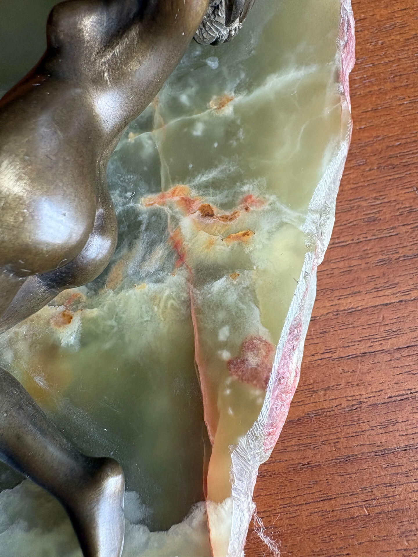 Art Deco female sculpture in bronze with onyx base.