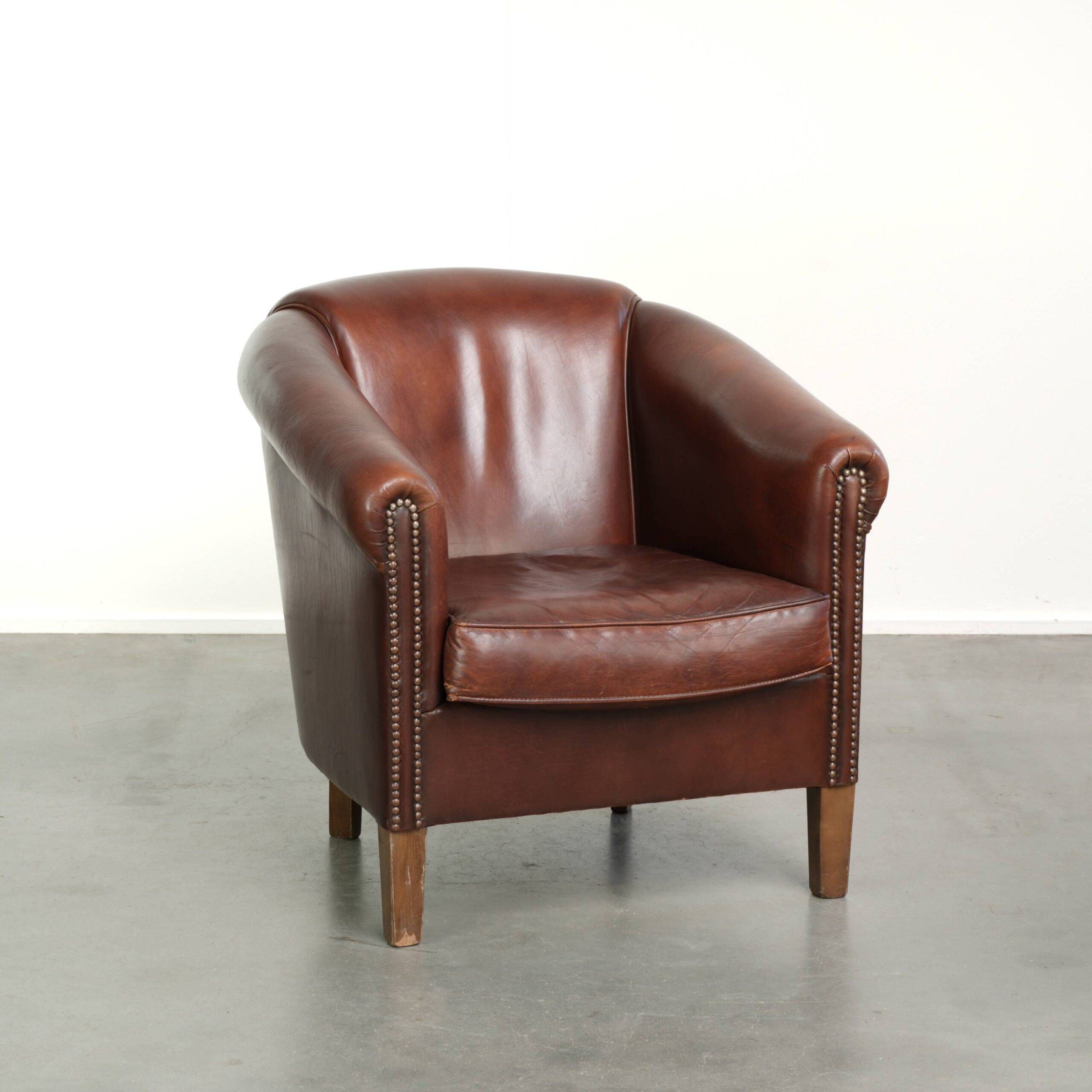 Sheepskin club armchair in English style with brown colour scheme