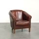 Sheepskin club armchair in English style with brown colour scheme