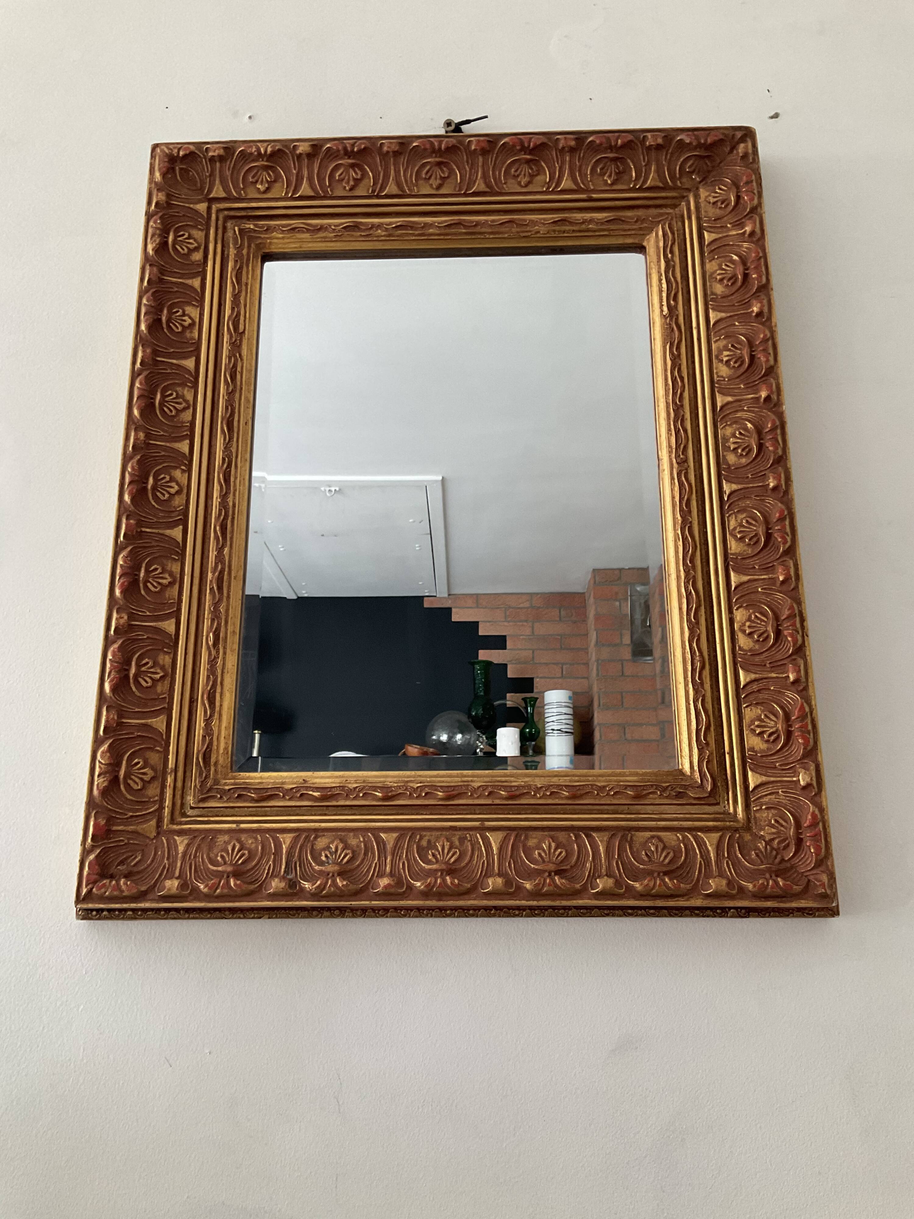 Old Beveled mirror in gilded wood