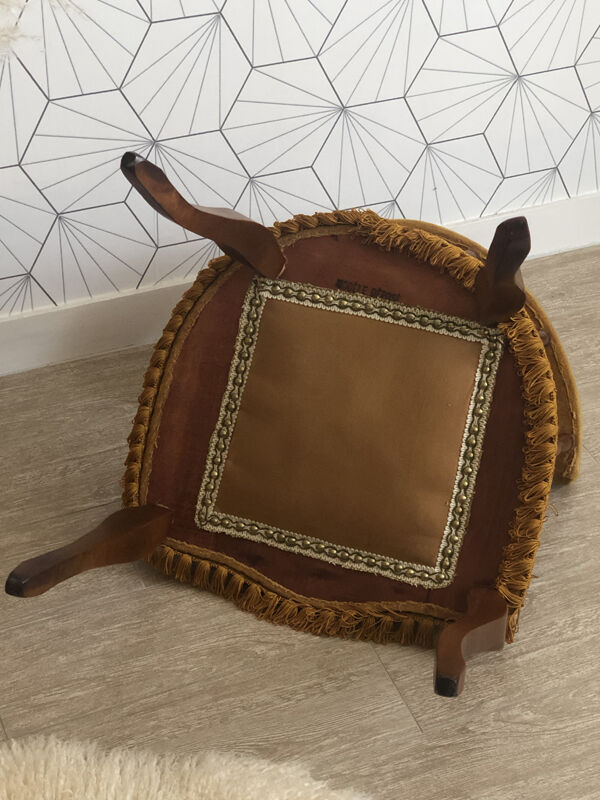 Vintage fringed gondola armchair