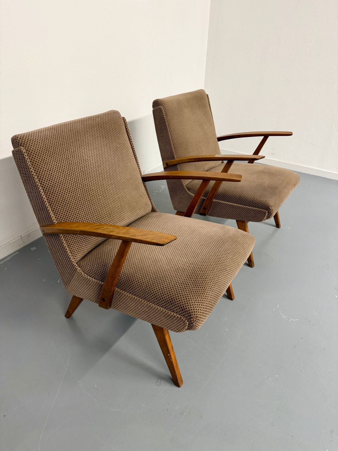 Set of 2 vintage wooden and fabric armchairs designed in the 1960s.