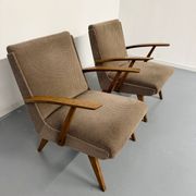 Set of 2 vintage wooden and fabric armchairs designed in the 1960s.