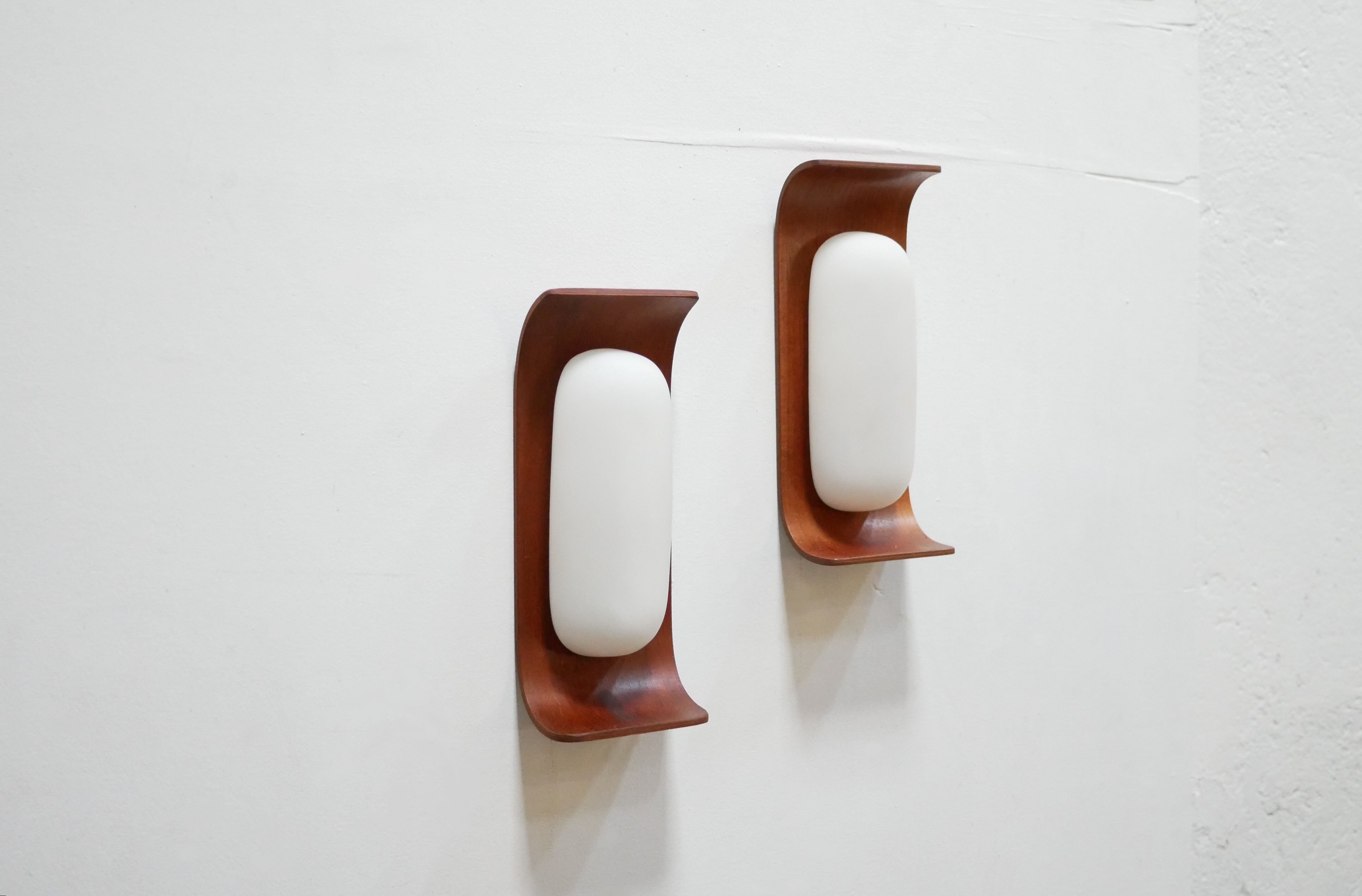 Pair of teak and opaline wall lamps by Goffredo Reggiani