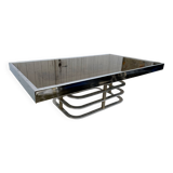 Coffee table with chrome base and mirrored glass top, vintage solar flare decor