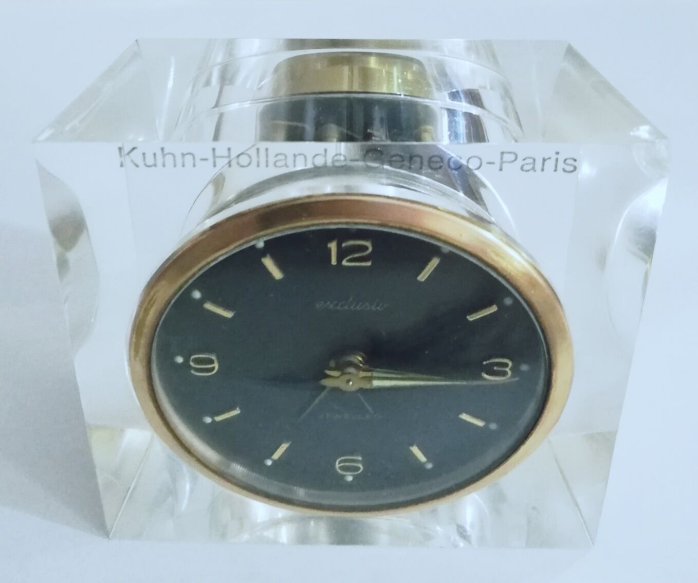 Alarm clock with exposed mechanism in plexiglass and brass
