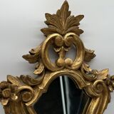 Wooden mirror with gilded stucco