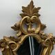 Wooden mirror with gilded stucco