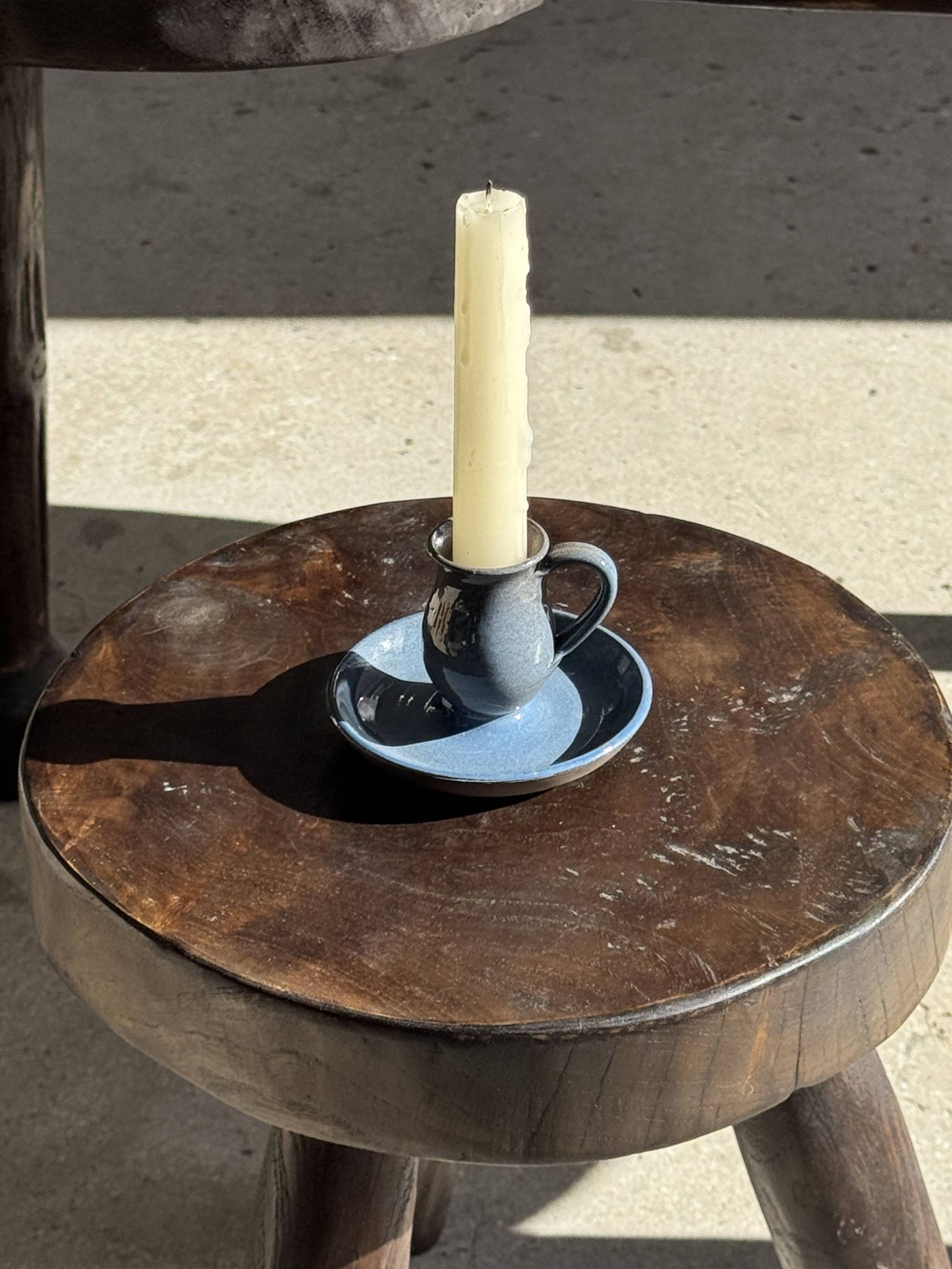Vintage hand-held candlestick in blue glazed stoneware with floral decoration by Poterie Millian.