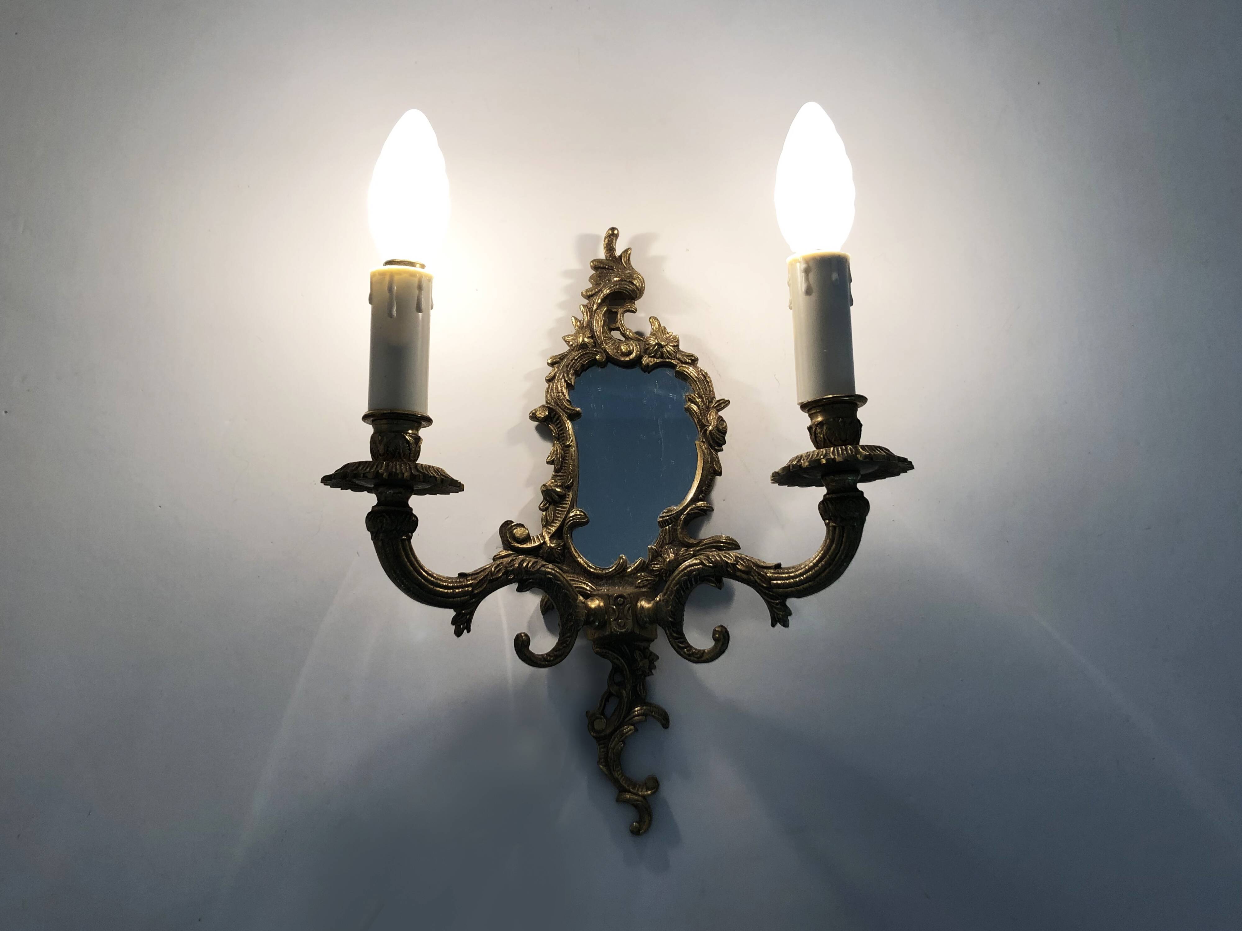 Pair of vintage bronze wall sconces with mirror and 2 candles. 1960s