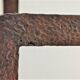 Pair of sculptural cast iron chenets with twisted heads