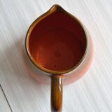 Orange ceramic pitcher