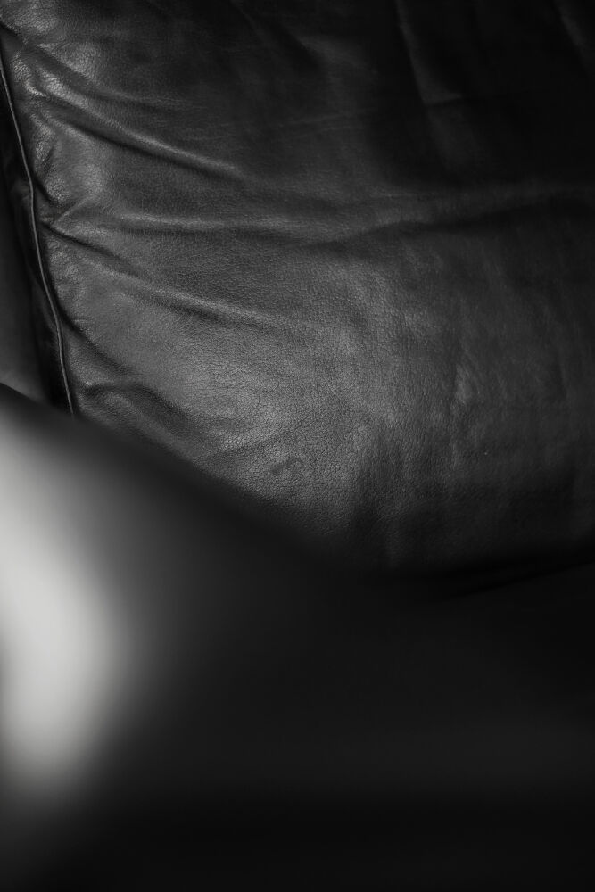 Mid-century danish modern minimalist black leather swivel armchair by georg thams, 1960s