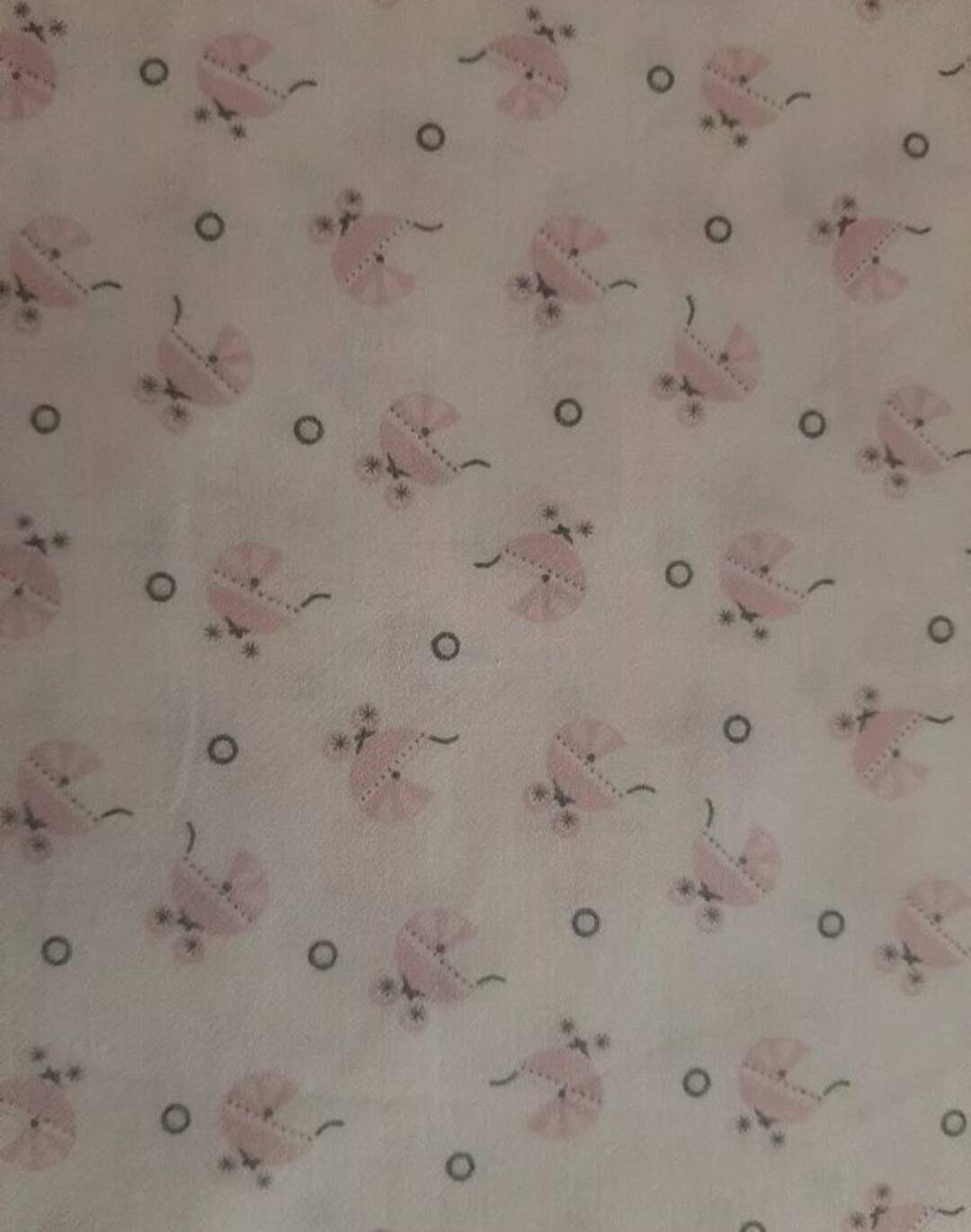 Vintage 1970s wicker cradle on wheels