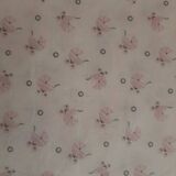 Vintage 1970s wicker cradle on wheels