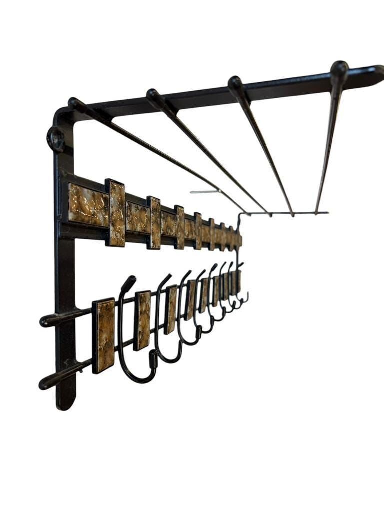 Porte-manteau mural vintage noir en métal avec accent en céramique